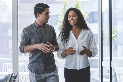 Two coworkers talking